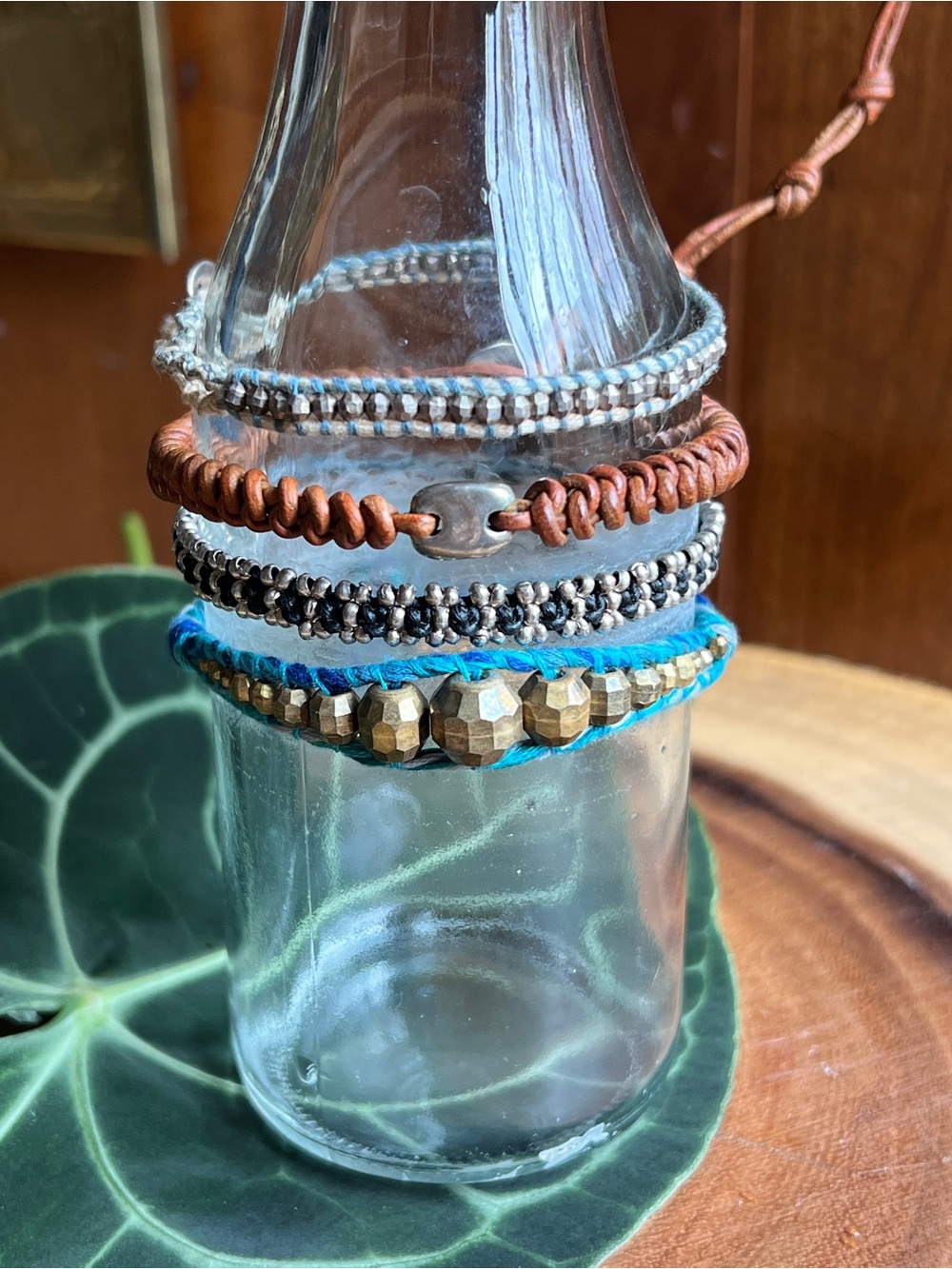 Set of Four. Stackable Beaded and Cord Bracelets - Blue, Brown, Silver, Gold